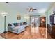 Bright living room with hardwood floors, comfortable seating, and a sliding door to the patio at 2152 Mountain City St, Henderson, NV 89052