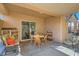 Inviting patio area with a dining set, comfortable chairs, and easy access to indoor spaces at 2152 Mountain City St, Henderson, NV 89052