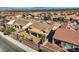 Aerial shot of a backyard including gravel desert landscaping, perimeter fence, and a covered patio area at 2345 Gondi Castle Ave, Henderson, NV 89044