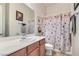 Bathroom featuring a single sink, vanity, tub, and a shower with decorative curtain at 2345 Gondi Castle Ave, Henderson, NV 89044
