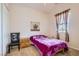 Cozy bedroom with neutral colors, a window, and closet space at 2345 Gondi Castle Ave, Henderson, NV 89044