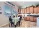 Eat-in kitchen dining nook with a large window for natural light and custom wood cabinets at 2345 Gondi Castle Ave, Henderson, NV 89044