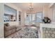 Cozy dining area adjacent to the kitchen with a chandelier and access to the backyard at 2345 Gondi Castle Ave, Henderson, NV 89044