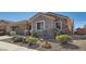 Attractive single-story home featuring stone accents, desert landscaping, and a well-maintained front yard at 2345 Gondi Castle Ave, Henderson, NV 89044