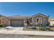 Charming single-story home with a two-car garage, landscaped front yard, and stone accent entry at 2345 Gondi Castle Ave, Henderson, NV 89044