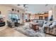 Open living area with tile floors, large windows, and access to the kitchen and dining area at 2345 Gondi Castle Ave, Henderson, NV 89044