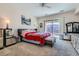 Spacious main bedroom with carpeted floors, a ceiling fan, and ample natural light at 2345 Gondi Castle Ave, Henderson, NV 89044