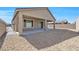 Backyard featuring a covered patio and low-maintenance landscaping at 2404 Elmont Ave, North Las Vegas, NV 89086
