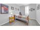 Charming bedroom with sports memorabilia, a cozy bed, and a window bringing natural light at 2404 Elmont Ave, North Las Vegas, NV 89086