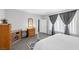 Comfortable bedroom featuring a gray color scheme and lots of natural light at 2404 Elmont Ave, North Las Vegas, NV 89086