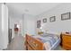 Bright bedroom with a twin bed, sports decor, and easy access to other rooms at 2404 Elmont Ave, North Las Vegas, NV 89086