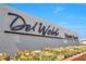 A stylish 'Del Webb North Ranch' community sign is framed by desert landscaping under a clear blue sky at 2404 Elmont Ave, North Las Vegas, NV 89086