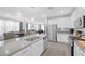 Contemporary kitchen featuring stainless steel appliances, granite counters, eat-in bar and an open-concept layout at 2404 Elmont Ave, North Las Vegas, NV 89086