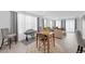 Bright, open-concept living space featuring hardwood floors and a seamless transition into the dining area at 2404 Elmont Ave, North Las Vegas, NV 89086