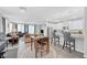 Bright, open-concept living space featuring hardwood floors and a seamless transition into the kitchen at 2404 Elmont Ave, North Las Vegas, NV 89086