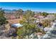 Suburban neighborhood featuring tree coverage and mountain views in the distance at 2517 Desert Glen Dr, Las Vegas, NV 89134