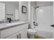 This bathroom boasts a shower and bath combo with white cabinets and granite countertops at 2517 Desert Glen Dr, Las Vegas, NV 89134