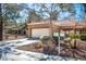 Charming single-story home with a well-maintained front yard and an attached two-car garage at 2517 Desert Glen Dr, Las Vegas, NV 89134