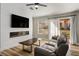 Cozy living room with modern fireplace, sleek TV, and comfortable seating, perfect for relaxation and entertainment at 2517 Desert Glen Dr, Las Vegas, NV 89134