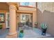 This beautiful patio features a sitting area and desert landscaping at 2517 Desert Glen Dr, Las Vegas, NV 89134