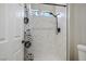Modern shower with marble tiling and a rain shower head at 2517 Desert Glen Dr, Las Vegas, NV 89134