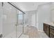 Bathroom showcasing a glass-enclosed shower and separate soaking tub at 2587 Tolmezzo St, Henderson, NV 89044