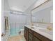 Traditional bathroom featuring double sinks and shower-tub combination at 2587 Tolmezzo St, Henderson, NV 89044