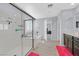 Bright bathroom with glass shower and a large soaking tub at 2587 Tolmezzo St, Henderson, NV 89044