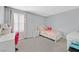 Cozy bedroom with a twin bed, desk, and bright natural light at 2587 Tolmezzo St, Henderson, NV 89044