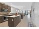 Stylish kitchen showcasing an island, stainless steel appliances, and open access to the living area at 2587 Tolmezzo St, Henderson, NV 89044