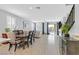 Bright living space with wood flooring, comfortable seating, and sliding glass doors to the backyard at 2587 Tolmezzo St, Henderson, NV 89044