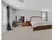 Spacious carpeted main bedroom with seating area and natural light at 2587 Tolmezzo St, Henderson, NV 89044