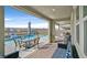 Relaxing covered patio overlooks a pool and a lovely backyard with mountain views at 2587 Tolmezzo St, Henderson, NV 89044