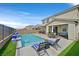 Inviting backyard oasis with a private pool, lounge chairs, and patio seating at 2587 Tolmezzo St, Henderson, NV 89044
