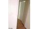 Hallway featuring wood floors and white walls and doors at 3435 Villa Knolls South Dr, Las Vegas, NV 89120