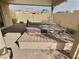 Backyard patio featuring a built-in spa and brick pavers, perfect for outdoor relaxation at 3581 Rio Paloma Ct, North Las Vegas, NV 89031