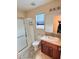 Bathroom featuring a glass shower, a tile floor, and a wooden vanity with a cream-colored countertop at 3581 Rio Paloma Ct, North Las Vegas, NV 89031