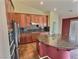 Gourmet kitchen features granite countertops, stainless appliances, large island with sink, and custom cabinets at 3581 Rio Paloma Ct, North Las Vegas, NV 89031