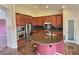 Gourmet kitchen features granite countertops, stainless appliances, large island with sink, and custom cabinets at 3581 Rio Paloma Ct, North Las Vegas, NV 89031
