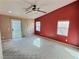 Carpeted living room with a fan, three windows, and a sliding glass door that provides access to the exterior at 3581 Rio Paloma Ct, North Las Vegas, NV 89031