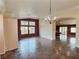 Open-concept living room with tile flooring and arched doorway at 3581 Rio Paloma Ct, North Las Vegas, NV 89031