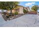Single-story home with desert landscaping and a long driveway at 4033 Bliss Canyon Ct, Las Vegas, NV 89129