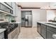 Spacious kitchen with stainless steel appliances, ample cabinetry, and white countertops at 4033 Bliss Canyon Ct, Las Vegas, NV 89129