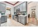 Well-equipped kitchen with stainless steel appliances, white countertops, and gray cabinetry at 4033 Bliss Canyon Ct, Las Vegas, NV 89129