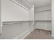 A walk-in closet with built-in shelving and racks, providing ample storage space at 4224 Golden Sol St, North Las Vegas, NV 89032