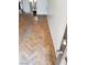 Living room with patterned hardwood flooring and white walls at 4231 White Sands Ave, Las Vegas, NV 89121