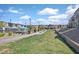 Well-maintained green space featuring lush grass, seating, and a view of the community pool at 527 Clearsable Ave, Henderson, NV 89044