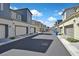 A street view of modern homes with attached garages on a sunny day with blue sky at 527 Clearsable Ave, Henderson, NV 89044