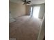 Spacious living room featuring sliding glass doors to let in natural light and a ceiling fan at 555 E Silverado Ranch Blvd # 1123, Las Vegas, NV 89183