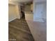 An open-concept floor plan with a blend of tile, carpet, and wood-style flooring at 555 E Silverado Ranch Blvd # 1123, Las Vegas, NV 89183